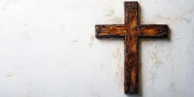 Rustic wooden cross mounted on a textured white wall showcasing craftsmanship and simplicity in design photo