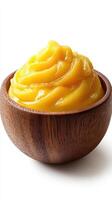 Creamy mango puree served in a wooden bowl for a refreshing dessert option or smoothie ingredient photo