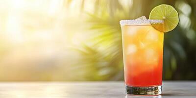 Refreshing tropical drink with lime and ice served in a glass on a sunny day photo