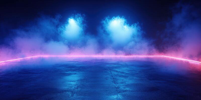 Vibrant neon lights illuminate a foggy urban space at night, creating a mesmerizing atmosphere filled with color and mystery