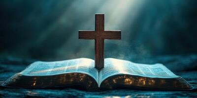 Focus on a wooden cross resting on an open Bible illuminated by soft light in a serene setting photo
