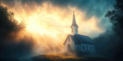 Light breaks through clouds over a serene countryside church at dawn, illuminating the peaceful landscape photo