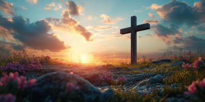 Cross standing in a field of flowers against a vibrant sunset sky with colorful clouds in the background photo