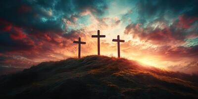Three wooden crosses stand tall against a stunning sunset with vibrant clouds in the sky photo