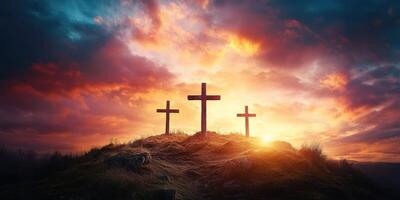 Sunrise over three crosses on a hill, symbolizing faith and hope in a serene landscape photo