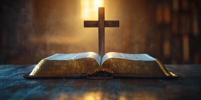 Bible open on a wooden table with a glowing cross highlighted in the background during early morning light photo