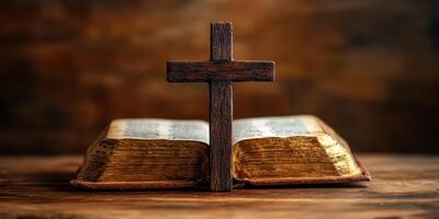 Wooden cross resting on an open vintage Bible with a warm background photo