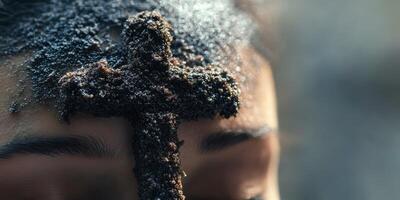 Ritual marking with ashes on forehead during religious observance in a serene outdoor setting photo