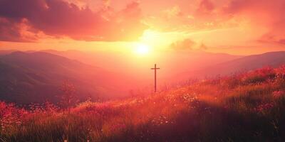 Sunset over mountains with a cross in a serene landscape filled with flowers and vibrant colors photo
