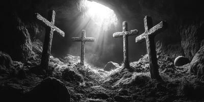 Crosses illuminated by light in a dark cave creating a serene atmosphere of reflection photo