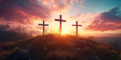 Sunrise over three crosses on a hill with vibrant sky and dramatic clouds photo
