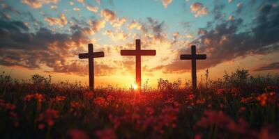 Crosses silhouetted against a vibrant sunset in a field of flowers, symbolizing faith and hope photo