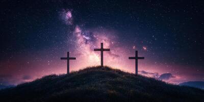 Three crosses stand on a hill under a starry sky with vibrant colors at dusk photo
