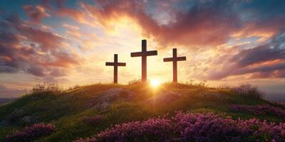 Beautiful sunset over three crosses on a hill surrounded by blooming flowers in the evening sky photo