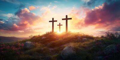 Sunrise over three crosses on a hilltop with vibrant sky and rocky landscape photo