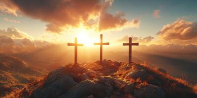 Three crosses on a mountain top at sunset overlooking a serene valley and distant mountains photo