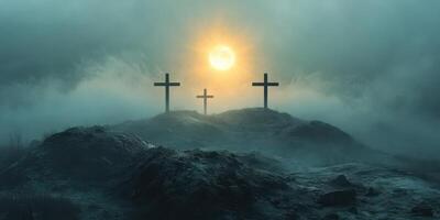 Mysterious landscape featuring three crosses under a glowing sunrise in a foggy atmosphere photo