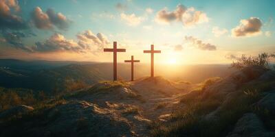 Sunset over the hills with three wooden crosses silhouetted against a vibrant sky photo