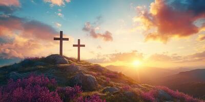 Sunset over a hilltop with two crosses surrounded by vibrant flowers photo