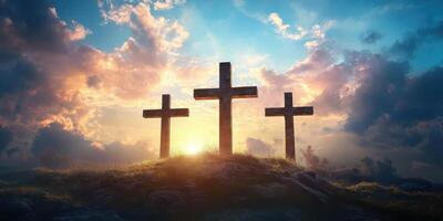 Three wooden crosses silhouetted against a vibrant sunrise with dramatic clouds in the background photo