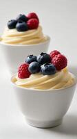 Delicious creamy dessert topped with fresh berries at a cozy dining table during afternoon delight photo