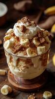 Delightful dessert with layers of creamy banana and crunchy toppings served in a glass bowl photo