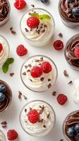 Delicious dessert cups featuring fresh raspberries, chocolate mousse, and whipped cream at a summer gathering photo