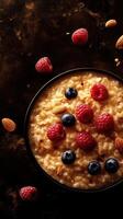 Creamy oatmeal bowl topped with fresh berries and nuts during a cozy breakfast at home photo