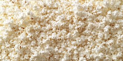 Freshly popped popcorn arranged in a heap, perfect for movie night or snacking during gatherings photo