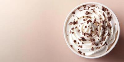 Delicious whipped cream topped with chocolate shavings served in a cup ready for enjoyment photo