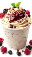 Delicious dessert featuring creamy vanilla ice cream topped with raspberry and blackberry photo
