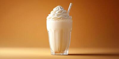 Creamy milkshake topped with whipped cream in a glass on a warm brown background photo
