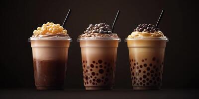 Delicious bubble tea drinks with creamy toppings served in clear cups on a dark background photo