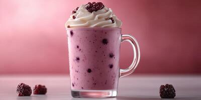 Delicious berry smoothie topped with whipped cream served in a clear glass cup on a stylish background photo