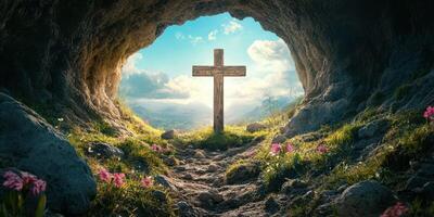 Cross standing in a serene cave surrounded by blooming flowers and bright sky photo