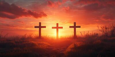Sunset silhouette of three crosses in a serene landscape during twilight in a rural area photo