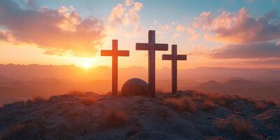 Sunset over mountainous landscape with three crosses and a large stone in the foreground photo
