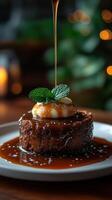 Delicious dessert being served with syrup on a plate in a cozy setting with ambient lighting photo