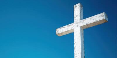 Large white cross against a vibrant blue sky during midday, symbolizing faith and spirituality photo