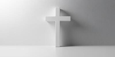White cross standing against a minimalistic gray background highlighting simplicity and spirituality in modern design photo