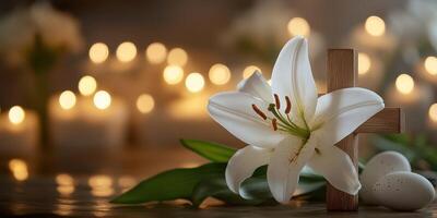 White lily and wooden cross adorned with candles and Easter eggs for a serene spiritual celebration photo