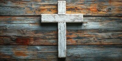 Weathered wooden cross on rustic wooden background highlighting spirituality and craftsmanship photo