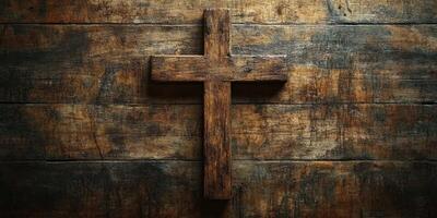 Rustic wooden cross mounted on weathered barn wood background creates a serene and spiritual atmosphere photo