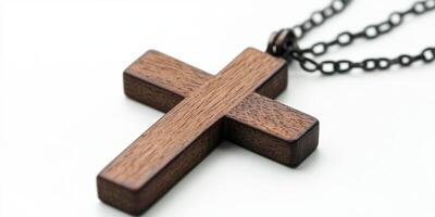 Wooden cross pendant on a chain highlighting its craftsmanship and design photo