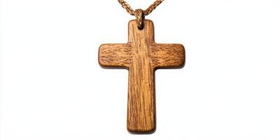 Wooden cross pendant on a simple chain displayed against a white background highlighting its craftsmanship and natural texture photo