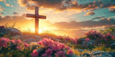 Sunset illumination over a wooden cross adorned with flowers among vibrant blooms in a serene landscape photo