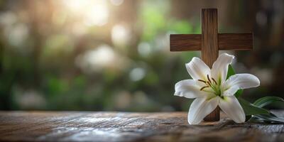 Wooden cross adorned with a white lily on a rustic table in a serene garden setting during dusk photo