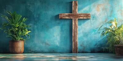 Rustic wooden cross shines against a vibrant turquoise wall with potted plants in a serene indoor setting photo