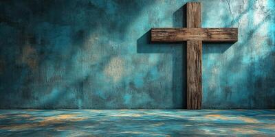 Wooden cross against a textured blue wall creating a serene atmosphere for reflection and contemplation photo