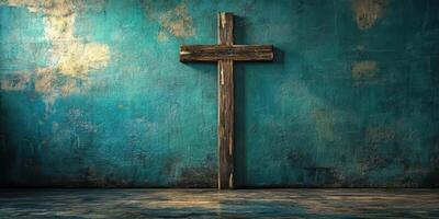 Rustic wooden cross on a textured blue wall in a dimly lit space photo
